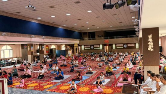 Students, teachers, parents and community members practicing yoga during International Yoga Day celebrations at DAV Gian Prakash Chopra Public School in Faridabad.