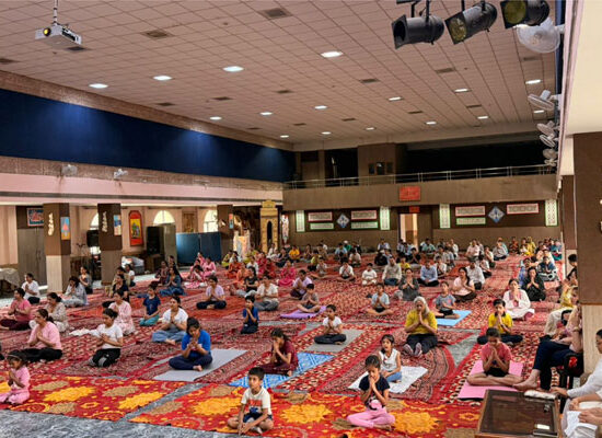 Students, teachers, parents and community members practicing yoga during International Yoga Day celebrations at DAV Gian Prakash Chopra Public School in Faridabad.