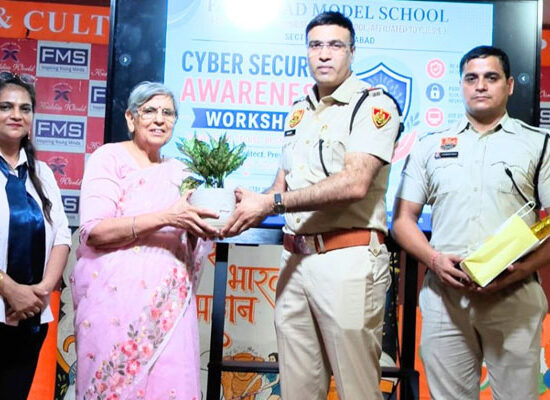 Cyber Cell officials conducting a Cyber Security Awareness Workshop for students at Faridabad Model School.
