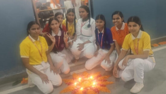 Students participating in Diya Lighting and Rangoli Competition at Ideal Public School Agwanpur
