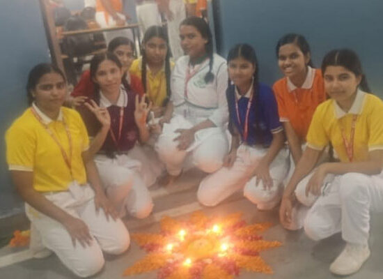 Students participating in Diya Lighting and Rangoli Competition at Ideal Public School Agwanpur